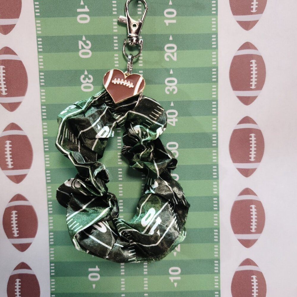 Football Themed Wristlet Keyring with a Football related charm attached !!